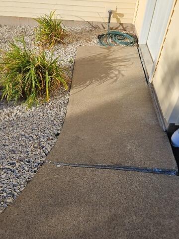 Sinking Front Concrete Walkway Lifted and Leveled in Marshfield, WI - Before Photo