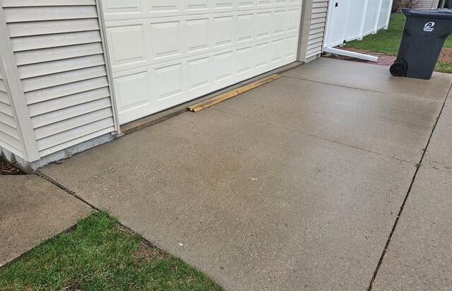 Sunken Concrete Driveway Lifted with PolyLevel Foam in Marshfield, WI - Before Photo