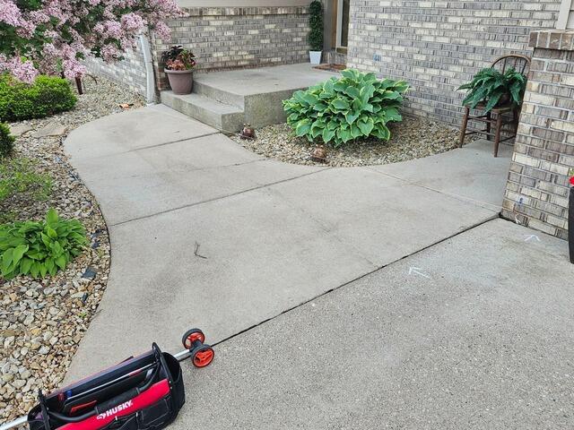 Cracked and Sunken Concrete Driveway Repair in Marshfield, WI - Before Photo
