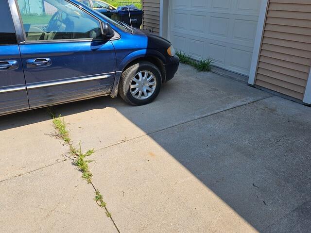 Concrete Driveway Lifted and Leveled in Marshfield, WI - Before Photo