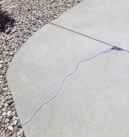 Cracked Concrete Driveway Repaired in Greenville, WI - Before Photo