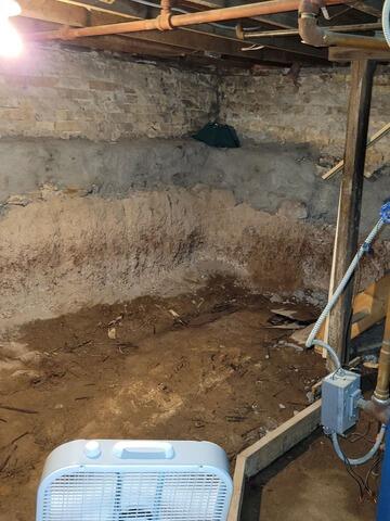 Wet Damp Crawlspace Gets Encapsulation & Water Control Repair in Port Washington, WI - Before Photo