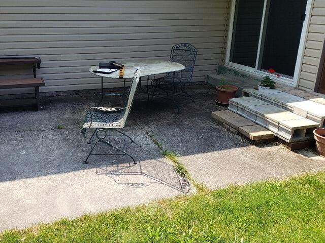 Cement Patio Repaired, Leveled & Sealed in Port Washington, WI - Before Photo