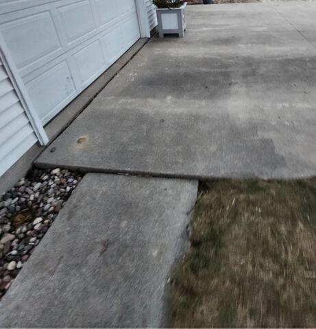 Concrete Driveway and Walkways Repaired & Leveled in Waupun, WI - Before Photo