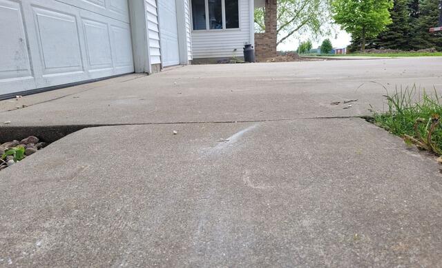 Concrete Driveway and Walkways Repaired & Leveled in Waupun, WI - After Photo