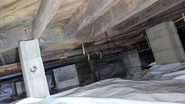 Sloping Floor Foundation Repair in Menominee, MI - Before Photo