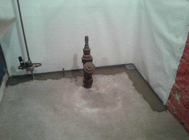 Wet Basement Repair with Sump Pump, Vapor Barrier & Drainage System Install in Ripon, WI - After Photo