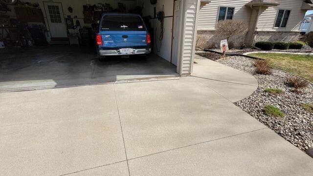Concrete Driveway Leveled & Sealed in Appleton, WI - Before Photo