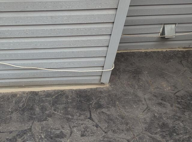 Uneven Stamped Concrete Patio Lifted & Joints Sealed in Kimberly, WI - After Photo