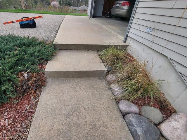 Garage Apron Concrete Repair, Lifting & Joint Sealing in Waupaca, WI - Before Photo