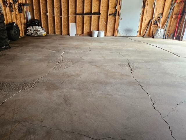 Broken Concrete Garage Floor Repair in Tomahawk, WI - Before Photo