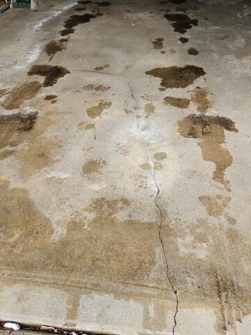 Settled & Cracked Garage Floor & Sidewalk Leveled & Sealed in Rothschild, WI - Before Photo