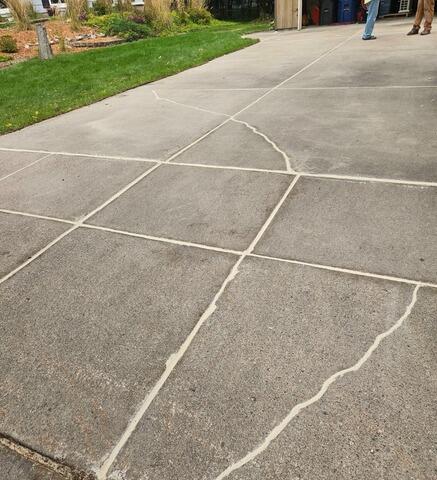 Sinking Concrete Driveway Slabs Lifted & Repaired, Fixing Trip Hazards & Water Issues in Rothschild, WI - After Photo