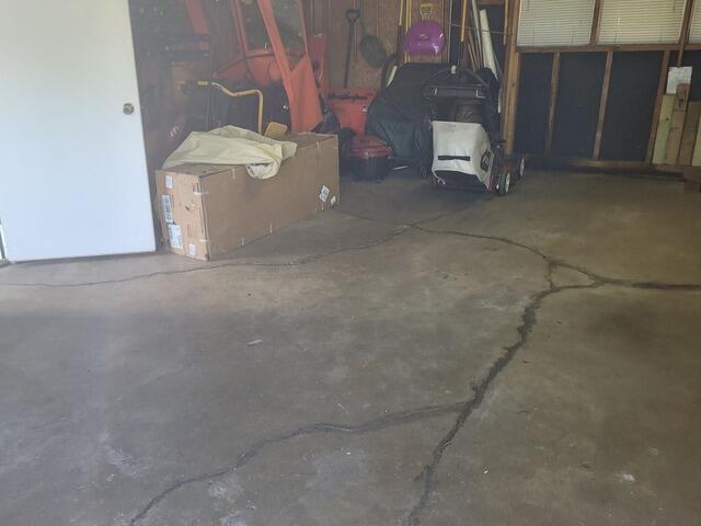 Concrete Garage Floor Repair in Kingsford, MI - Before Photo