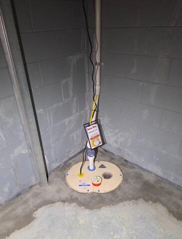 Drainage & Battery Back-up Sump Pump System Solves Basement Water Issues in Kingsford, MI - After Photo