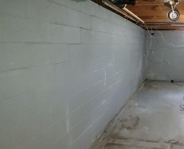 Failing Foundation with Stair-Step Cracking is Repaired & Stabilized in Kingsford, MI - Before Photo
