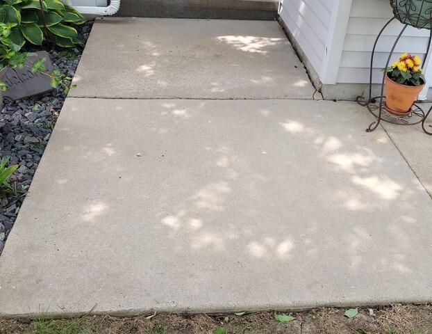 Sunken Concrete Lifted & Joints Sealed in Mayville, WI - Before Photo