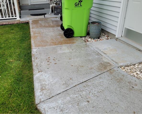 Sunken Concrete Driveway Lifted with Poly Level Foam in Mayville, WI - Before Photo