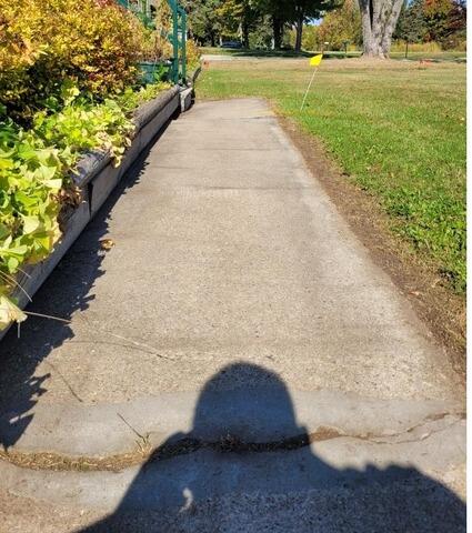 Sunken Concrete Lifted and Repaired in Little Suamico, WI - Before Photo