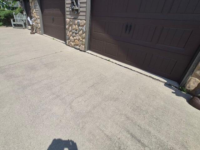Concrete Driveway Repair in Little Suamico, WI - Before Photo