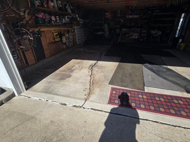 Cracked Garage Floor Repaired in Oconto, WI - Before Photo