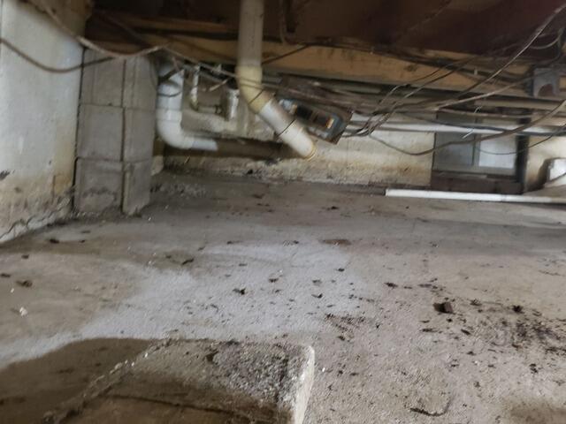 Crawl Space Vapor Barrier Encapsulation & Sump Pump Installation in Oconto, WI - Before Photo