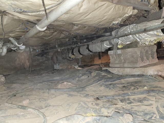 Musty, Damp Crawl Space and Floor Joists Repaired & Stabilized in Oconto, WI - Before Photo