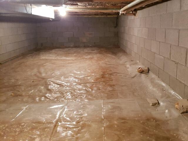Crawl Space Encapsulation & Insulation Under Home Addition in Antigo, WI - Before Photo