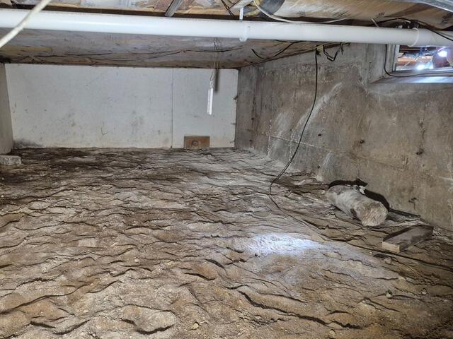 Crawl Space Encapsulation & Moisture Control for Home Addition in Antigo, WI - Before Photo