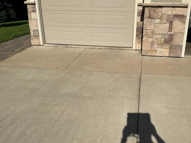 Sunken Garage Apron and Walkway Concrete Repair in Schofield, WI - Before Photo