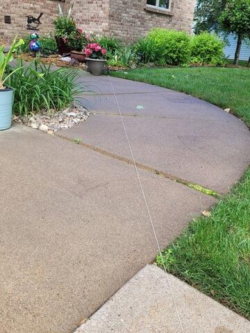 Concrete Leveling for Driveway, Sidewalk and Front Steps in Merrill, WI - Before Photo
