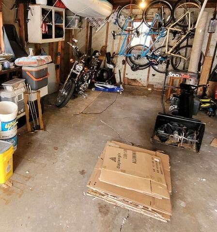 Garage Floor Concrete Leveling and Crack Repair in Green Bay, WI - Before Photo