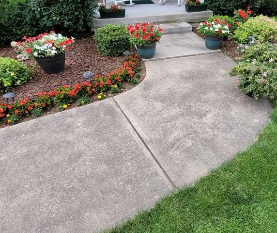 Concrete Sidewalk Leveling and Crack Repair in Green Bay, WI - Before Photo