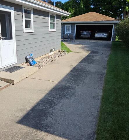 Concrete Driveway Leveling and Crack Repair in Appleton, WI - Before Photo