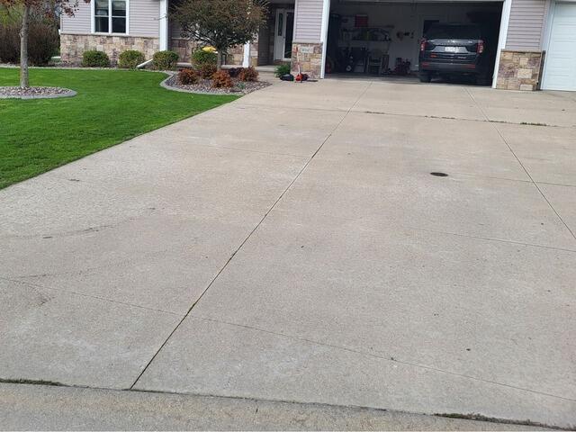 Concrete Driveway Leveling and Crack Repair in Menasha, WI - Before Photo
