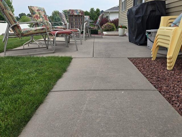 Sunken Back Patio and Walkway Lifted and Repaired in De Pere, WI - Before Photo