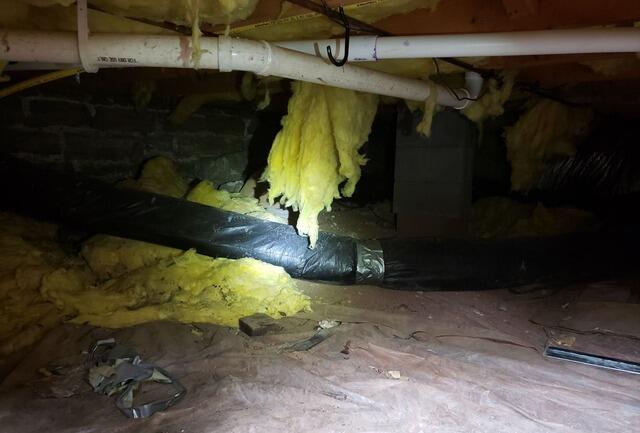Sloping Floors Stabilized with Crawl Space Support in De Pere, WI - Before Photo