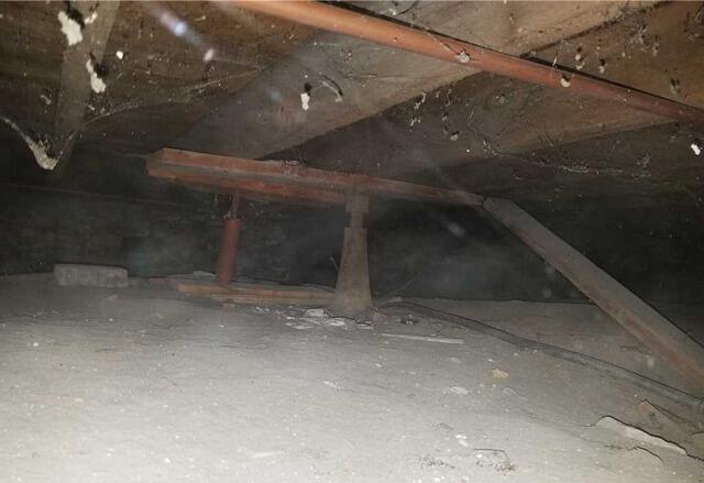Failing Floor Supports Stabilized in De Pere, WI - Before Photo