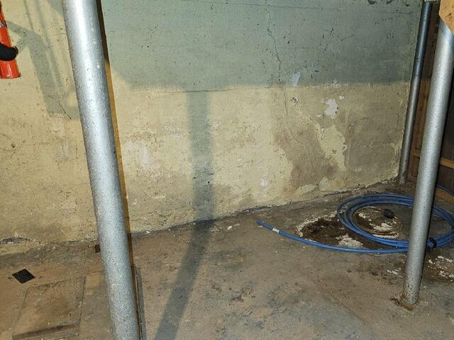 Wet Basement Waterproofed in Denmark, WI - Before Photo