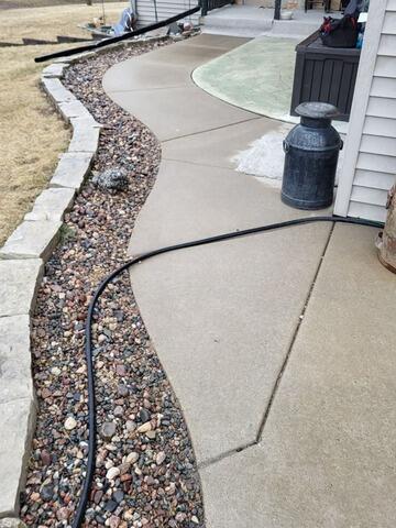 Driveway and Front Walkway Leveled, Sealed and Protected in Greenleaf, WI - Before Photo