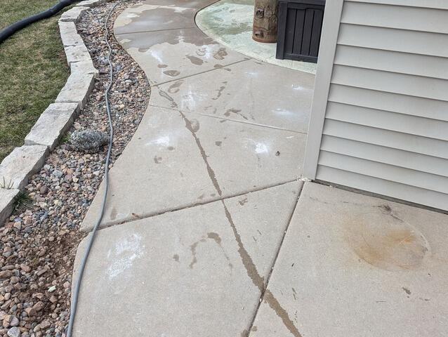 Driveway and Front Walkway Leveled, Sealed and Protected in Greenleaf, WI - After Photo