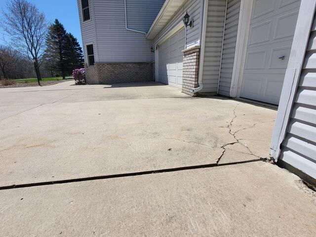 Sunken Garage Apron Lifted and Sealed in Oneida, WI - Before Photo