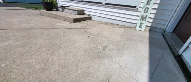 Sunken Driveway and Concrete Steps Repaired in Pulaski, W - Before Photo