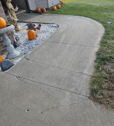 Sunken Front Sidewalk and Concrete Step Lifted in Pulaski, WI - Before Photo