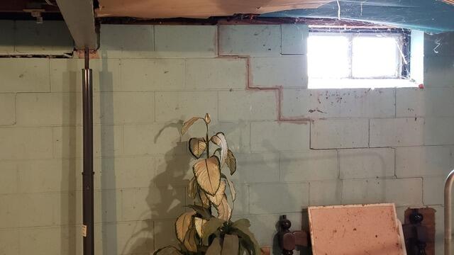 Stair-Step Foundation Wall Cracks Stabilized with Steel Bracing in Appleton, WI - Before Photo