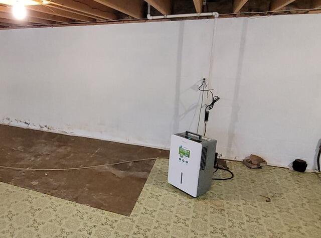 Basement Waterproofing with Interior Drainage and SuperSump Installation in Black Creek, WI - Before Photo