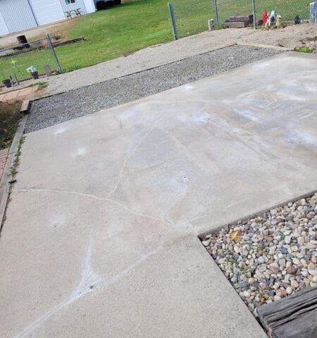 Concrete Leveling and Crack Sealing for Backyard Slab and Garage Walkway in Black Creek, WI - After Photo
