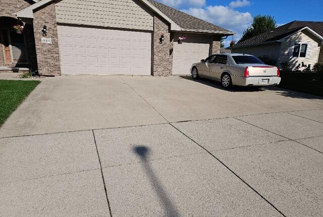 Concrete Driveway and Front Sidewalk Leveling & Joint Sealing in Combined Locks, WI - Before Photo