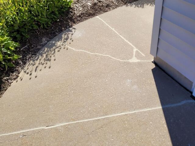 Concrete Driveway and Front Sidewalk Leveling and Crack Repair in Combined Locks, WI - After Photo