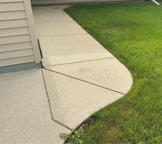 Concrete Driveway and Curved Sidewalk Leveling and Crack Repair in Combined Locks, WI - Before Photo